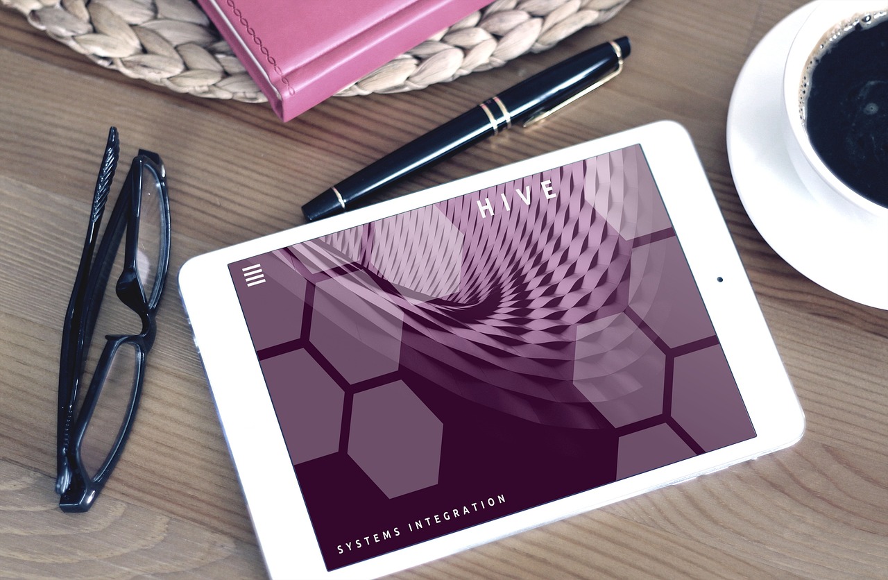 Website design mockups on a desk